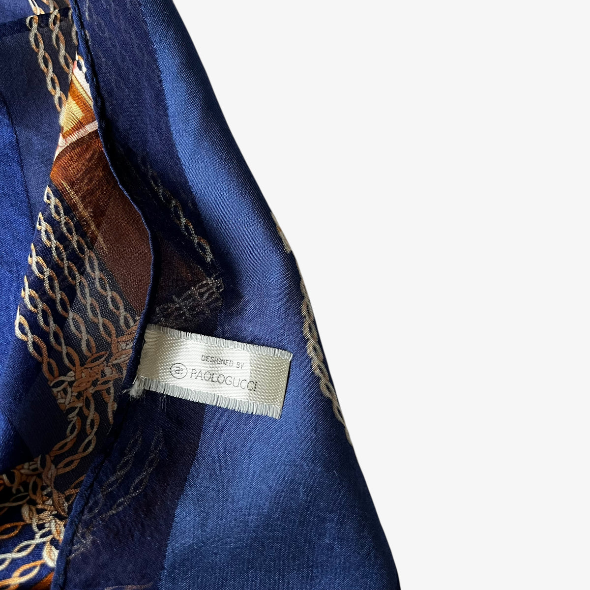 Paolo Gucci label on a vintage 80s women's pink horsebit and brown equestrian strap print navy silk scarf.