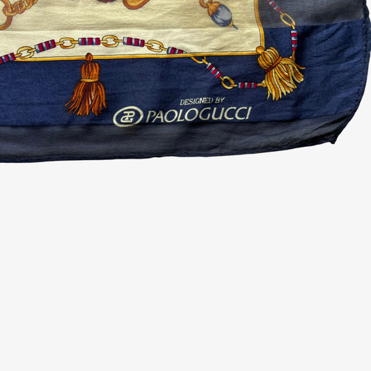 Paolo Gucci spell out logo on women's vintage 90s Sam Whan medallion chain and green tartan print navy silk scarf.