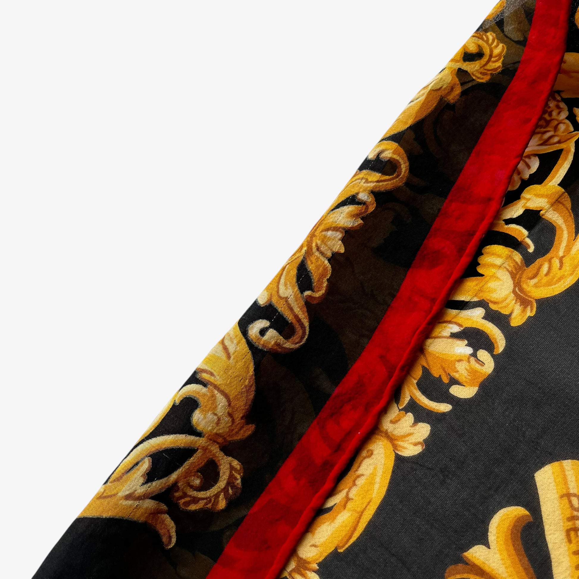 hand rolled edges on vintage 80s women's Pierre Balmain baroque rope print black silk scarf.