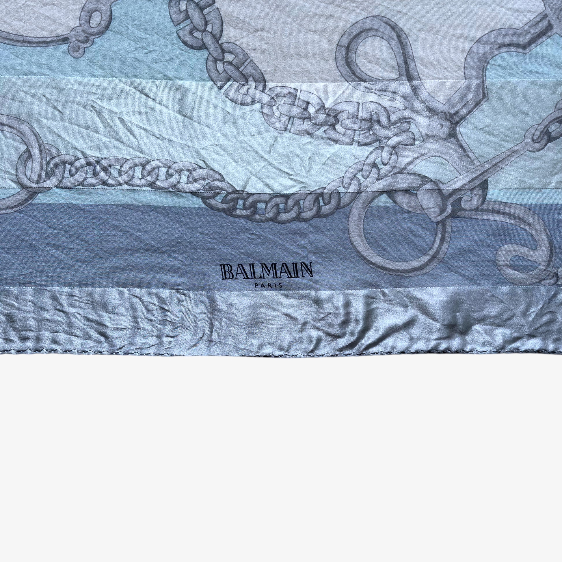 Balmain Paris spell out logo on women's vintage 90s geometric horsebit print blue silk scarf.