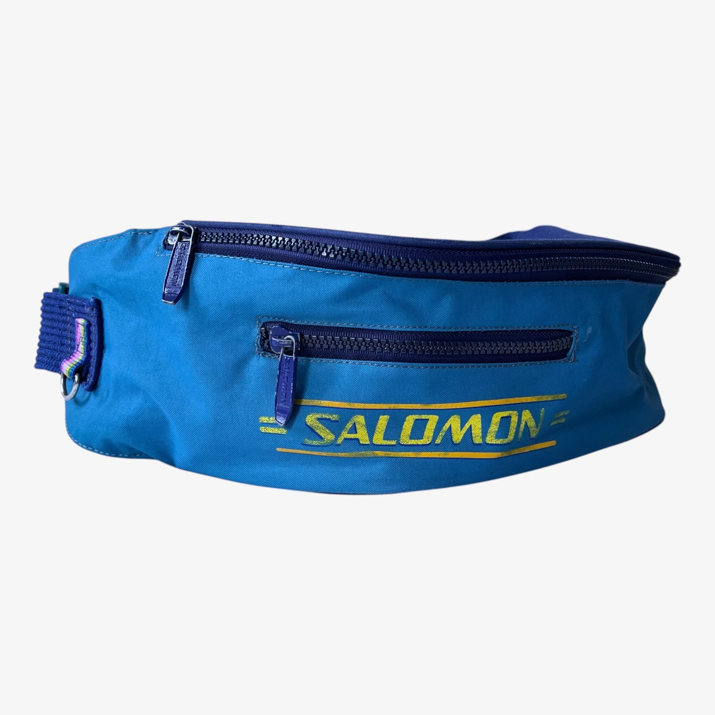 Blue fanny pack with Salomon branding on a white background.