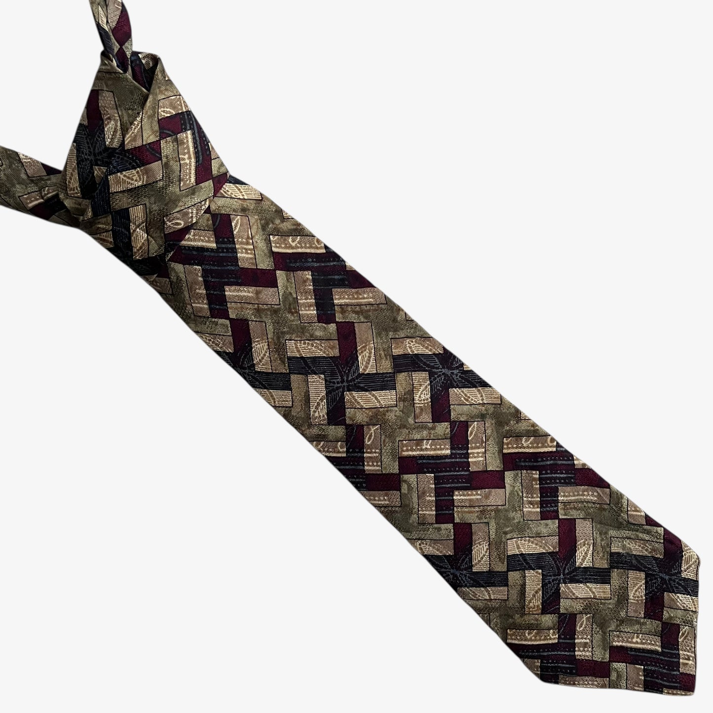 Vintage 80s Trussardi abstract geometric print silk tie on a white background.