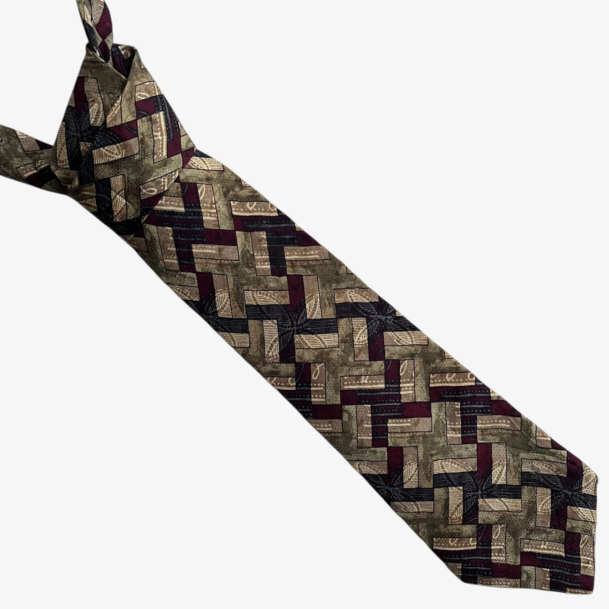 Vintage 80s Trussardi abstract geometric print silk tie on a white background.