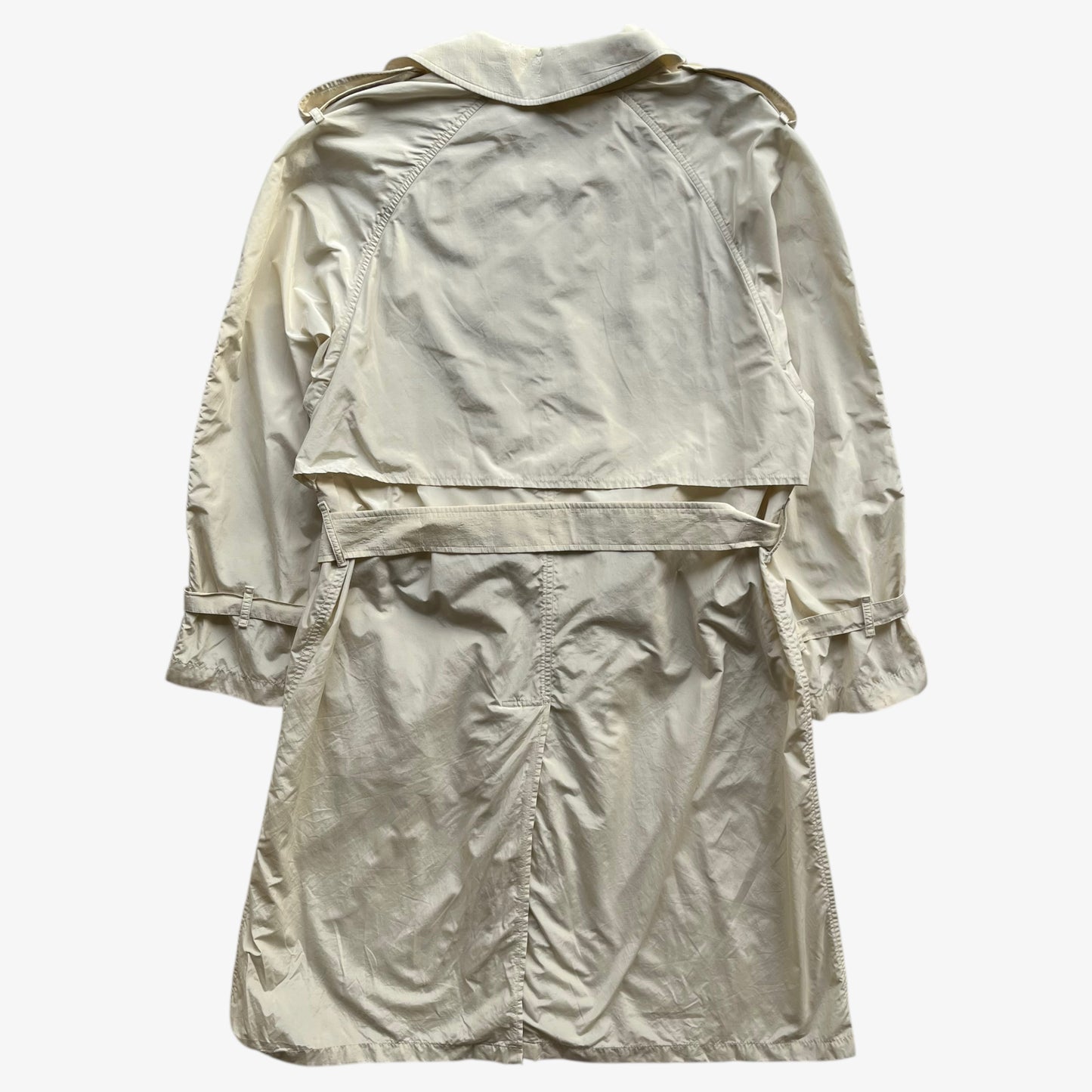 Back of women's vintage 80s Burberry double breasted cream trench coat.