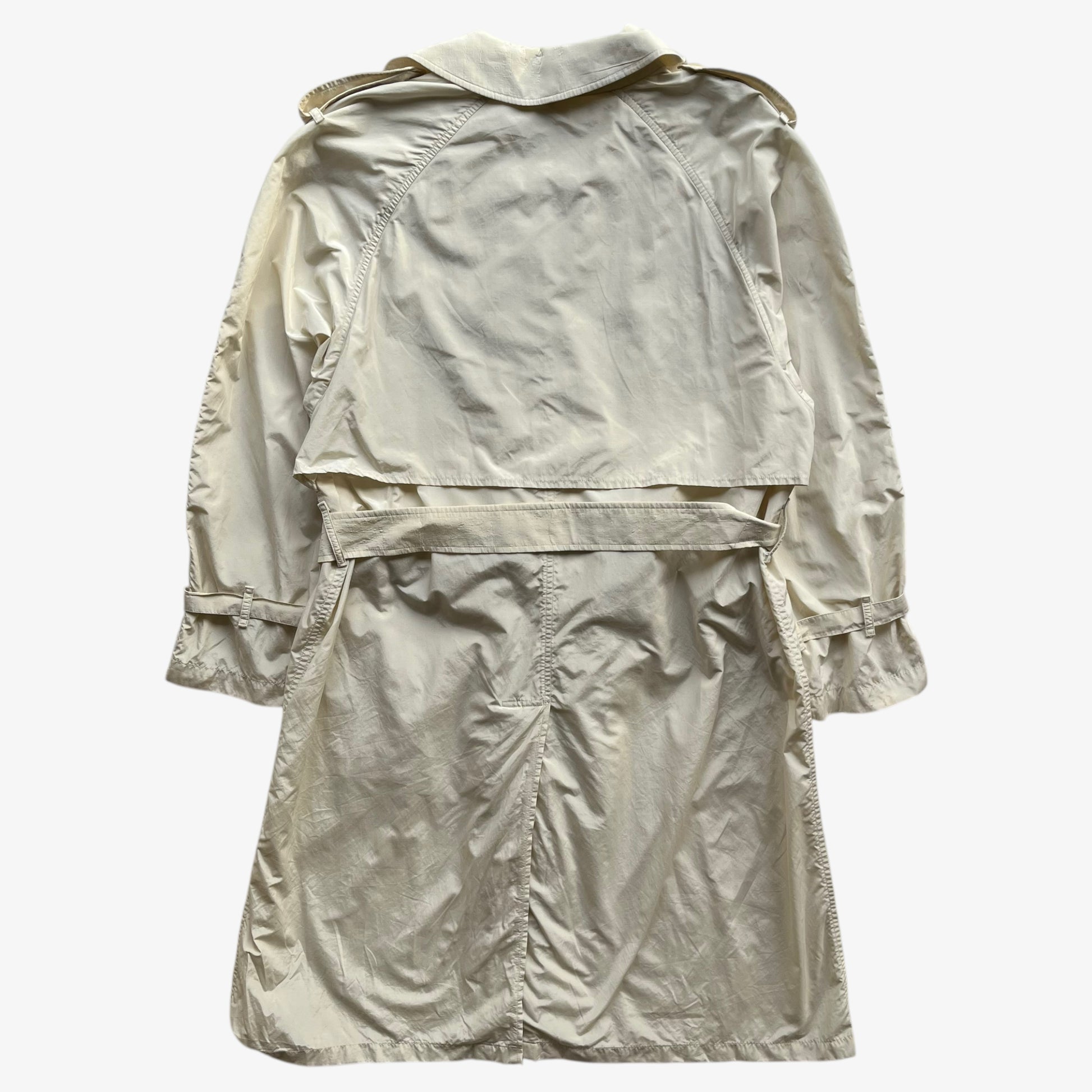 Back of women's vintage 80s Burberry double breasted cream trench coat.