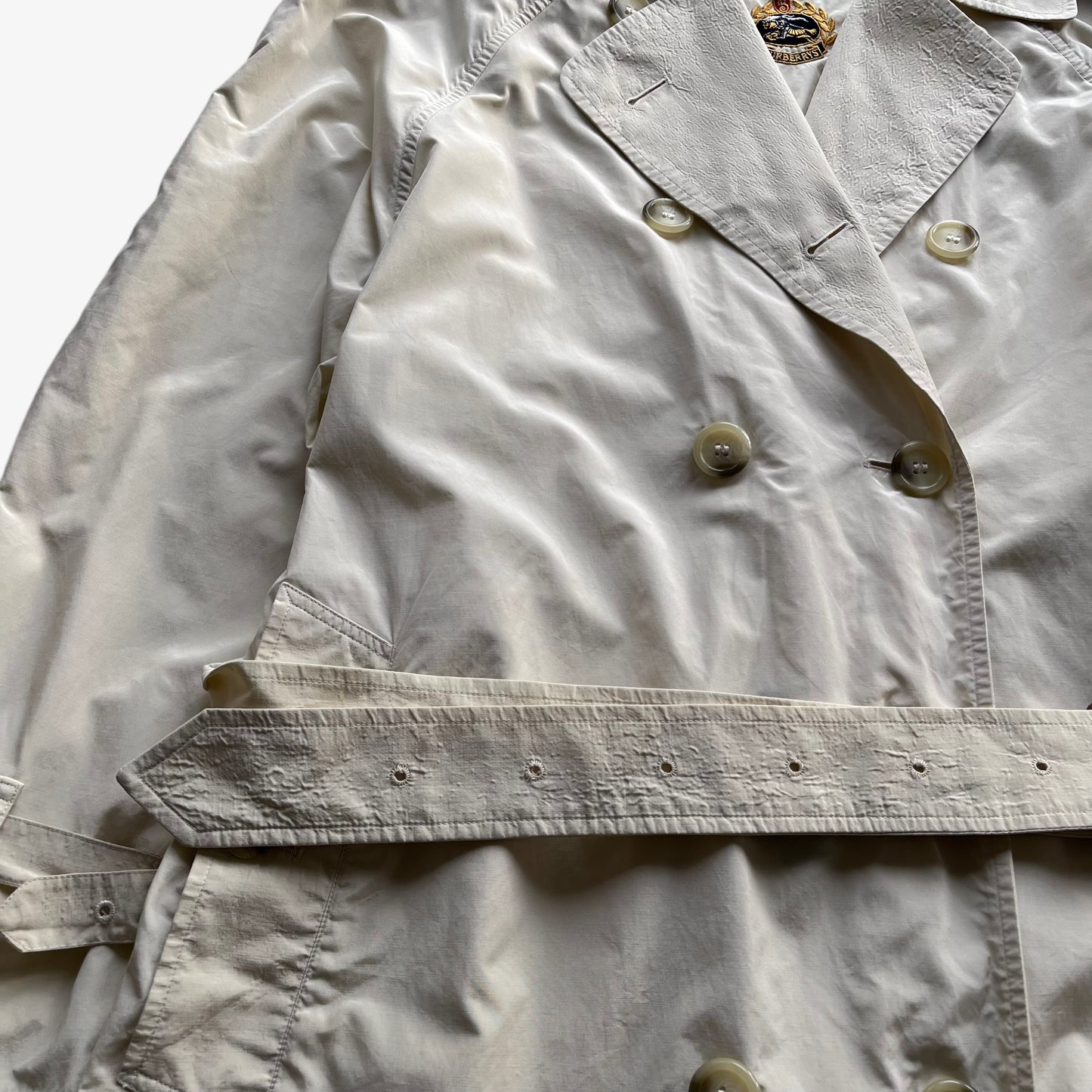 Belt of women's vintage 80s Burberry double breasted cream trench coat.