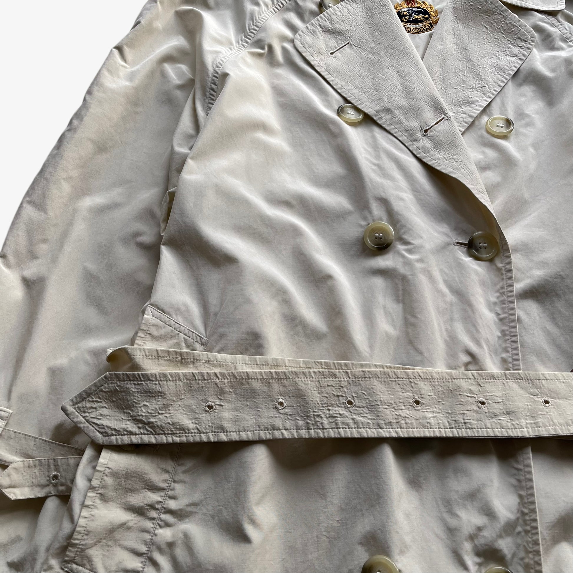Belt of women's vintage 80s Burberry double breasted cream trench coat.