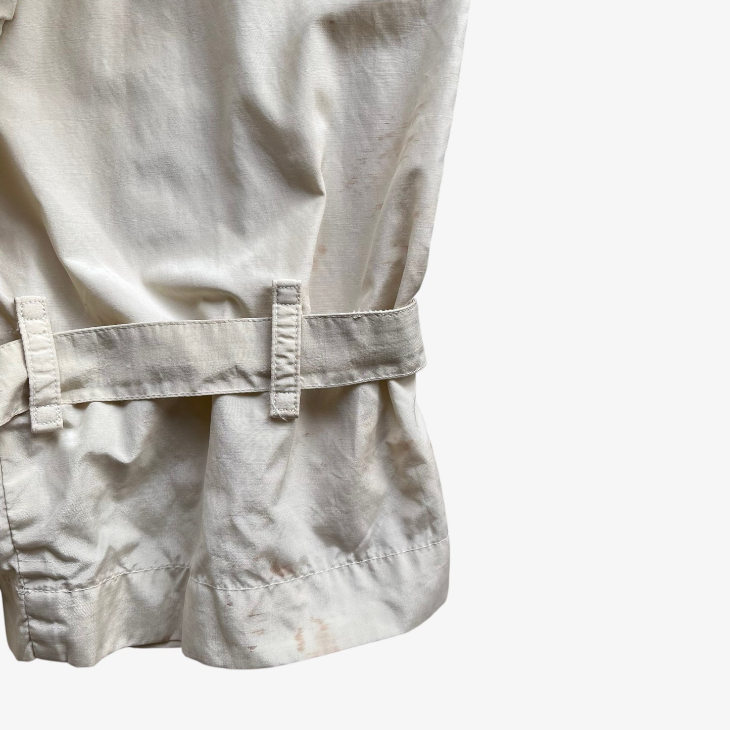 Patina on cuff of women's vintage 80s Burberry double breasted cream trench coat.