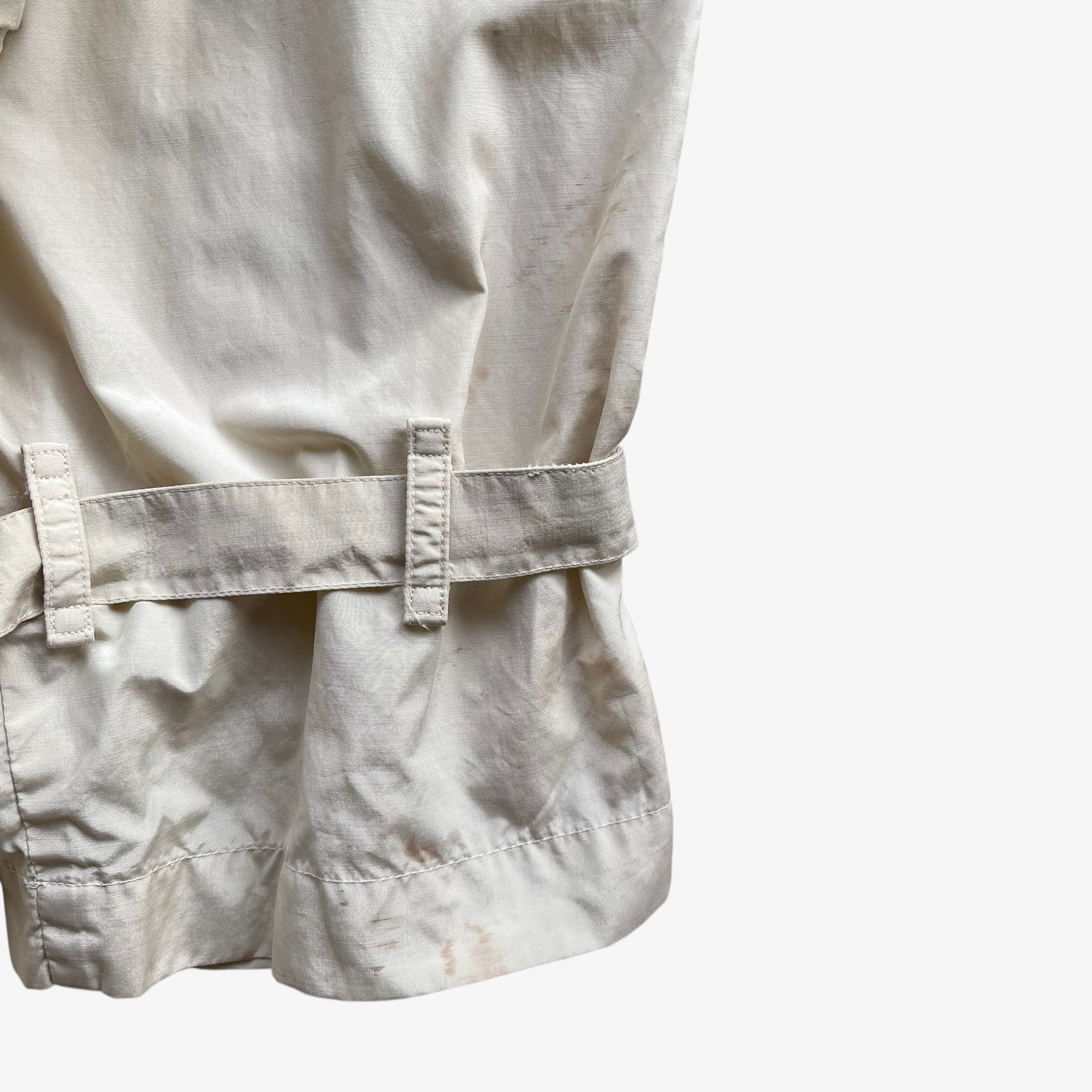 Patina on cuff of women's vintage 80s Burberry double breasted cream trench coat.