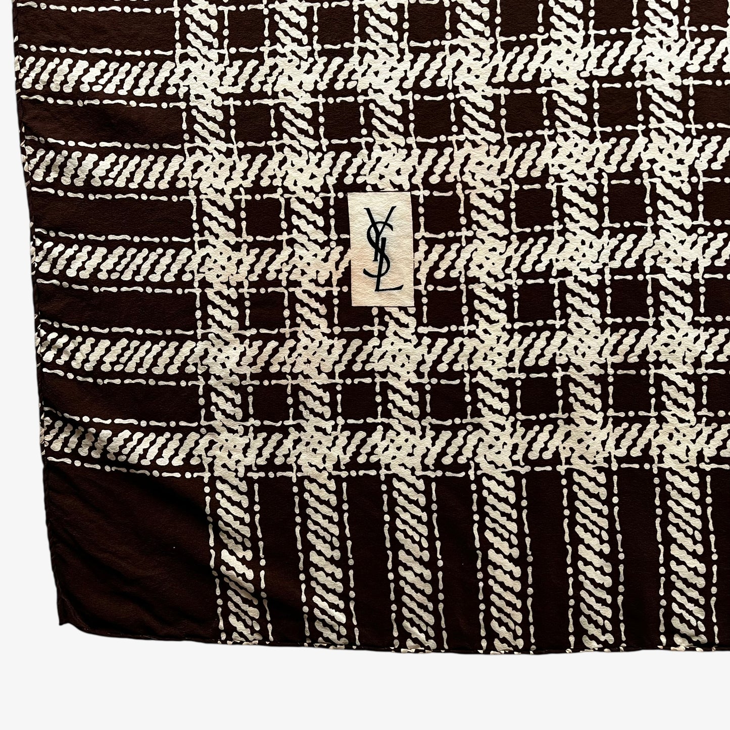 YSL motif on a women's vintage 80s Yves Saint Laurent brown checkered print silk scarf.