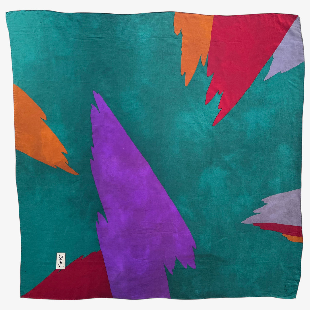 Colourful abstract print of women's vintage 80s Yves Saint Laurent green silk scarf.