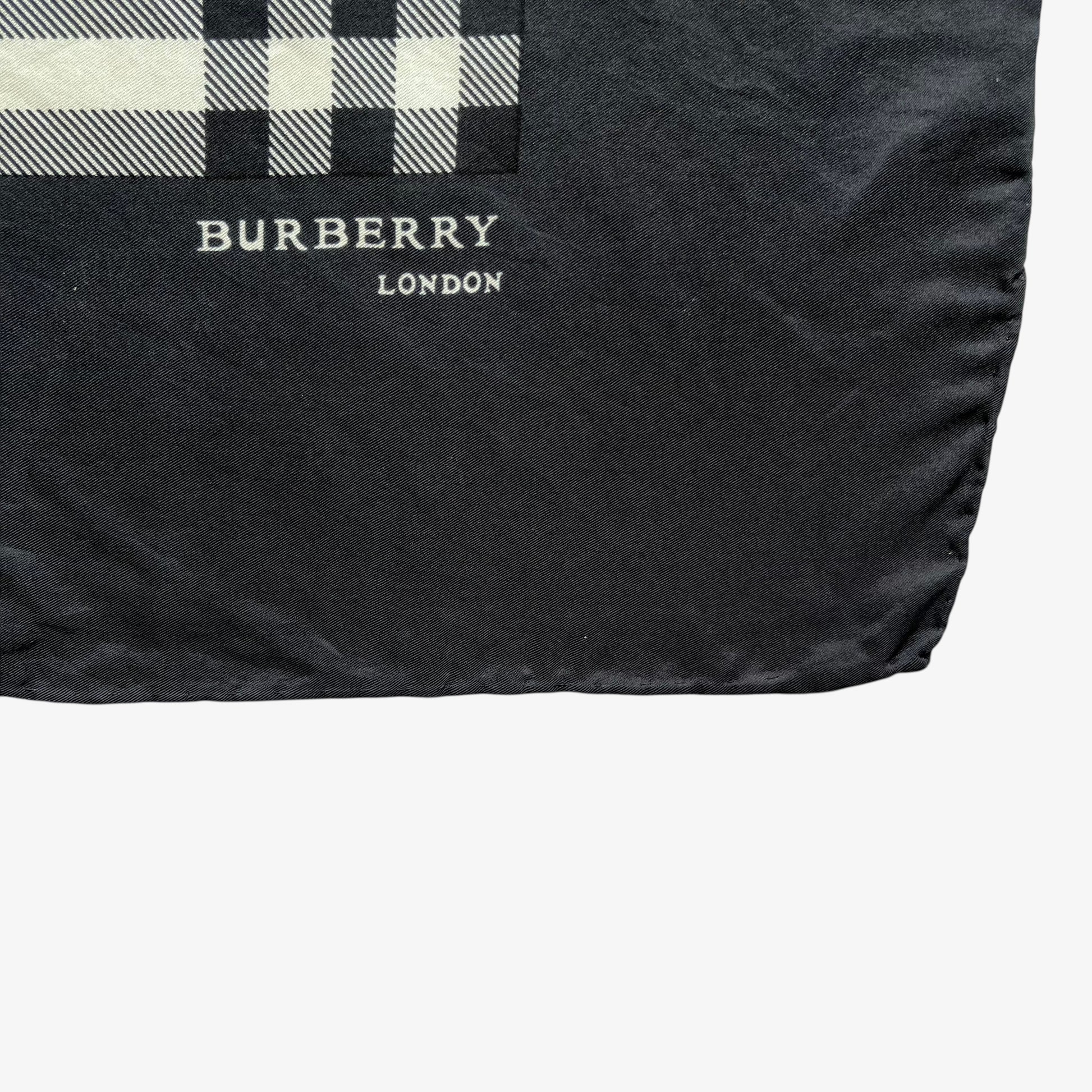 Burberry London spell out logo on women's vintage 90s black nova check print silk scarf.