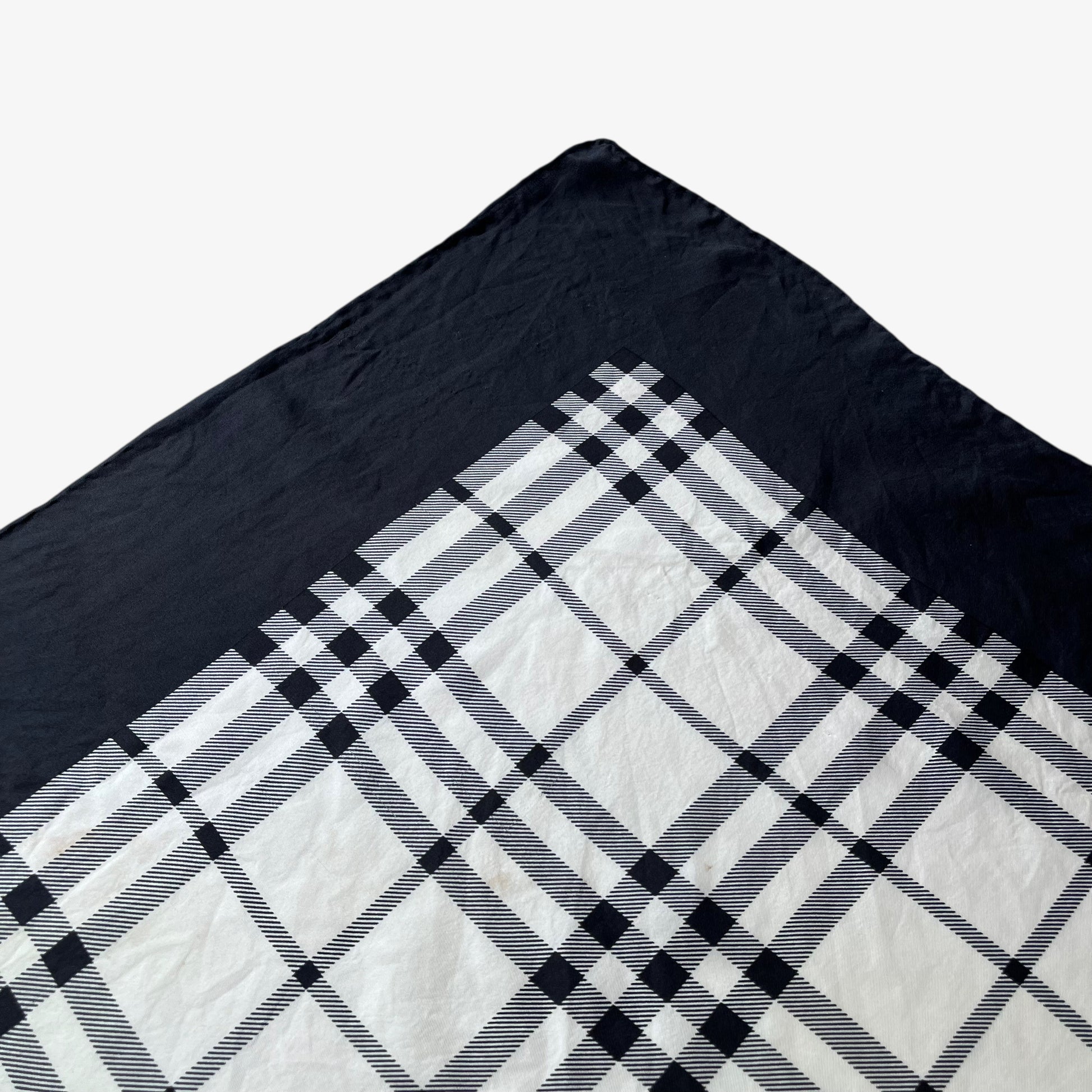 Plaid striped pattern of women's vintage 90s Burberry black nova check print silk scarf.