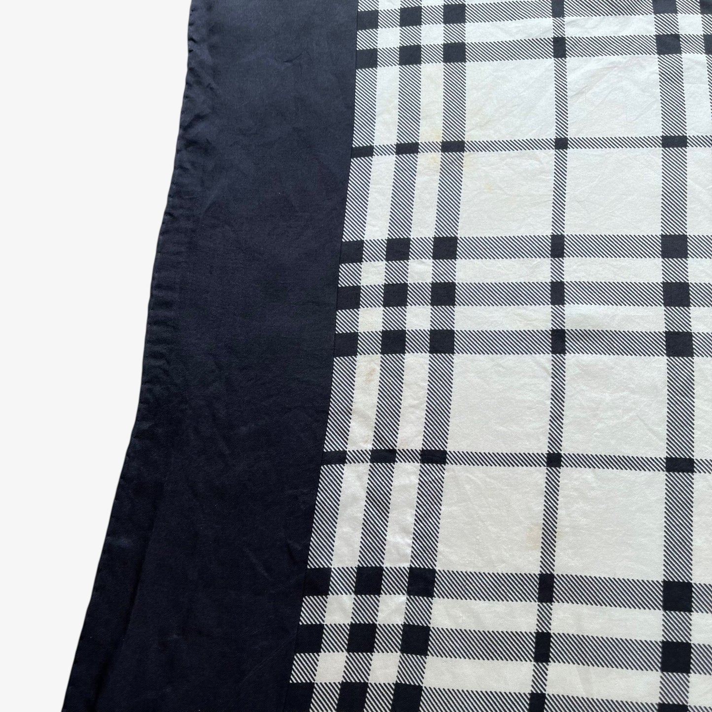 Tartan pattern of women's vintage 90s Burberry black nova check print silk scarf.