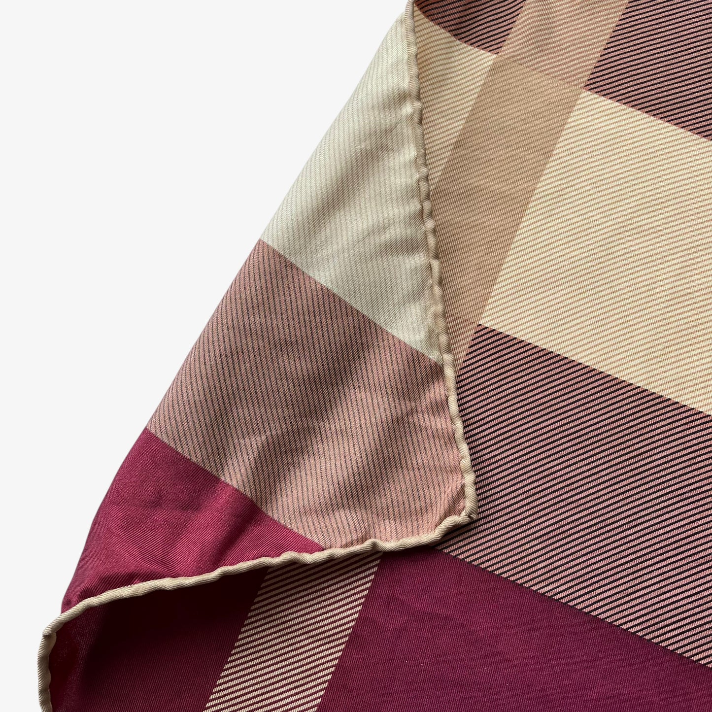 Hand rolled edges on women's vintage 90s Burberry purple nova check print silk scarf features a tartan design.