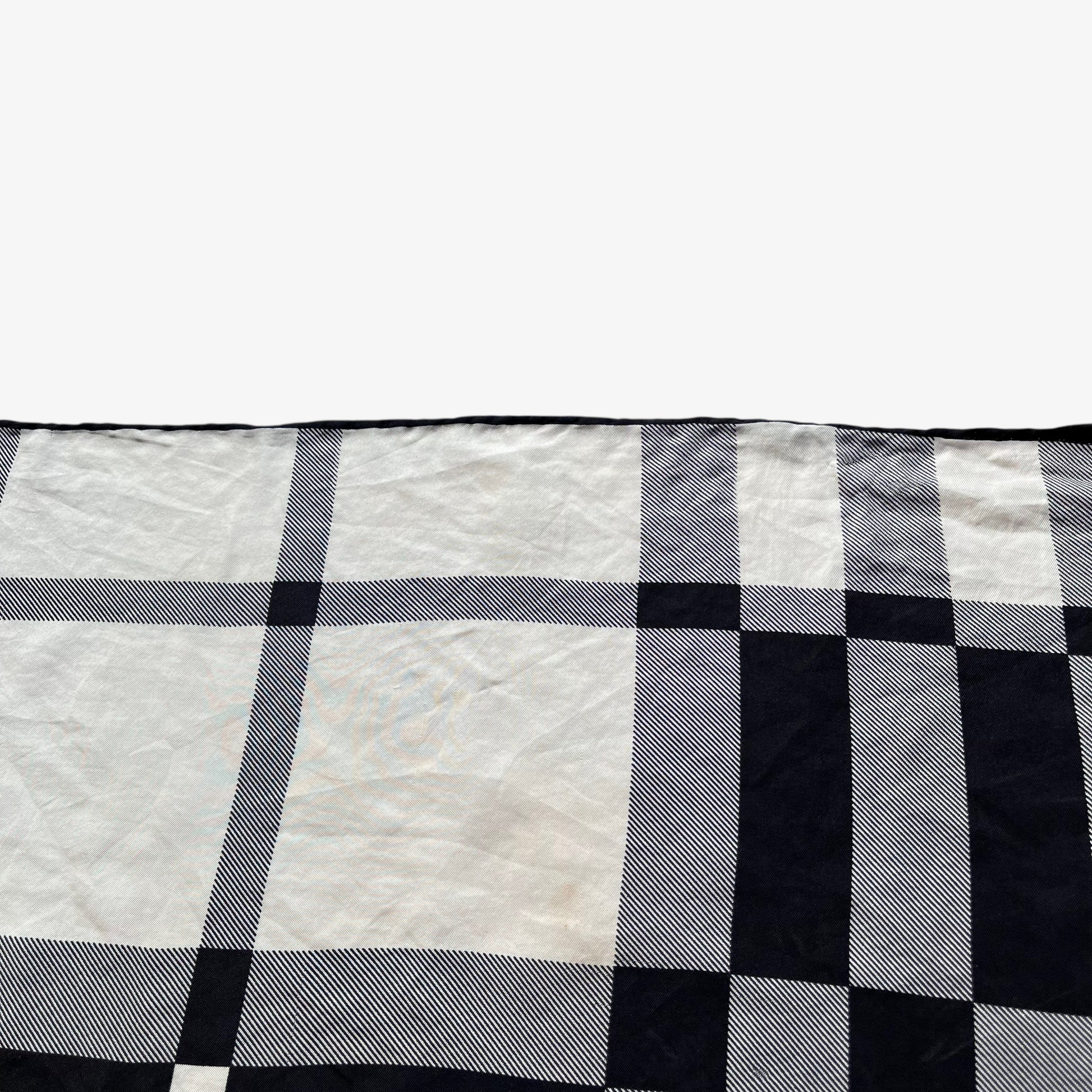 Patina on women's vintage 90s Burberry white and black nova check print silk scarf.