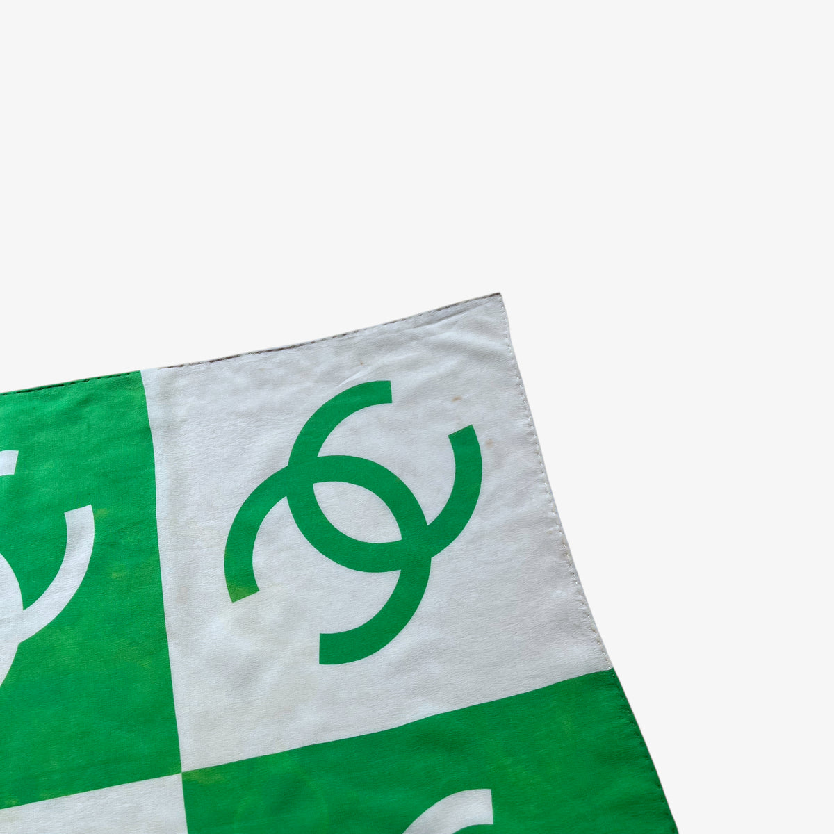 Patina on women's vintage 90s Chanel interlocking CC checkered print green silk scarf.