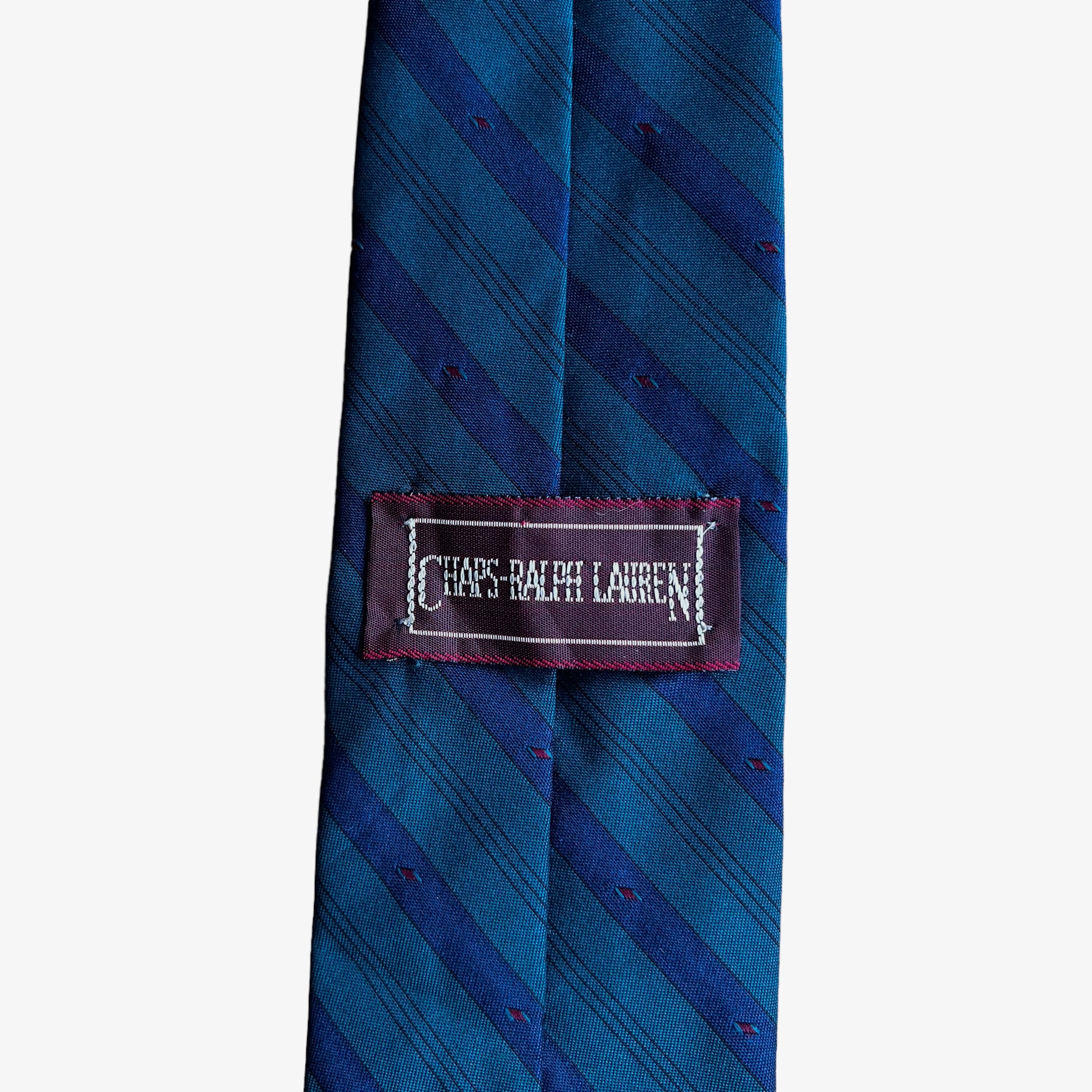 Label of vintage 90s Chaps Ralph Lauren green and blue striped silk blend tie.