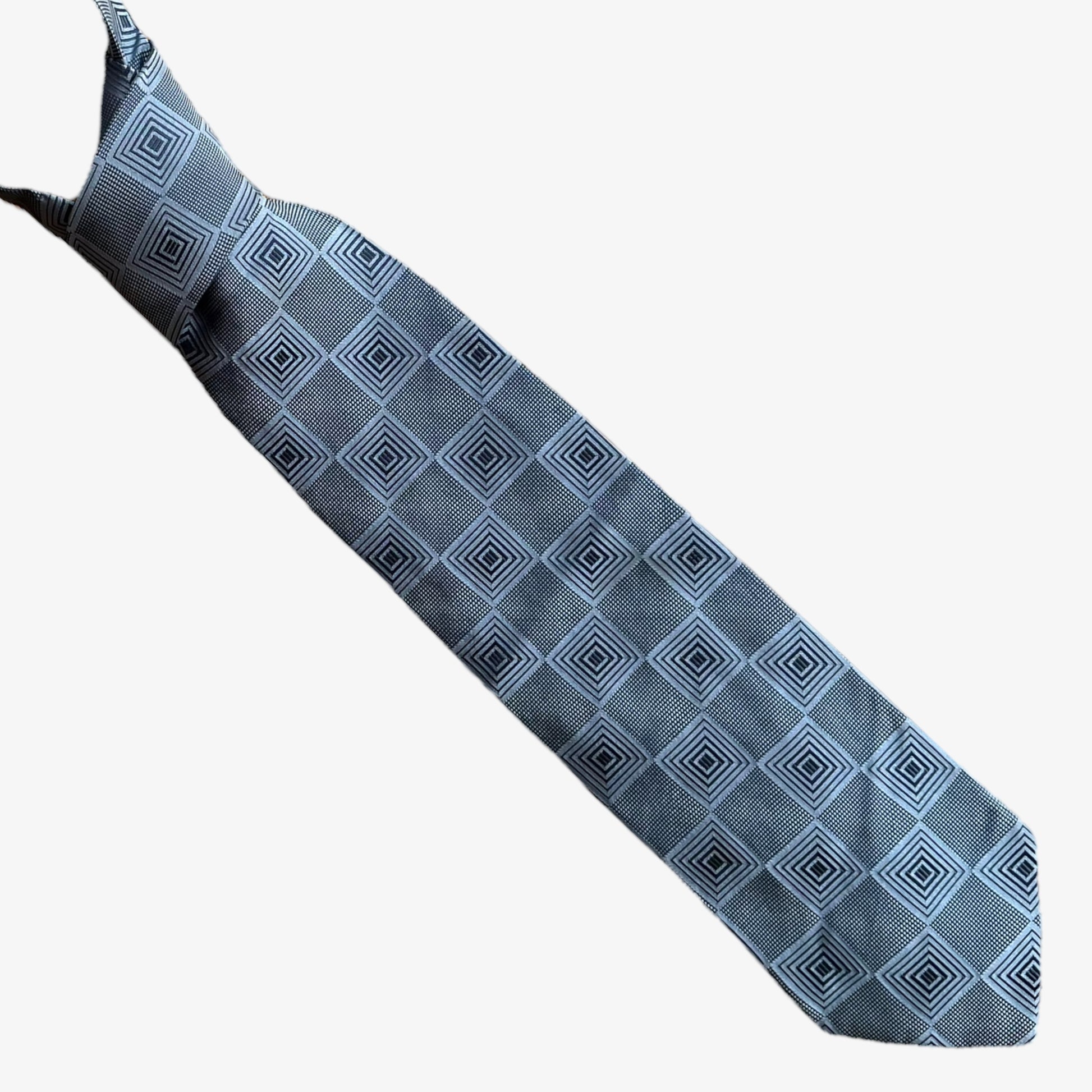 A vintage 90s Ermenegildo Zegna geometric abstract print silver silk tie.