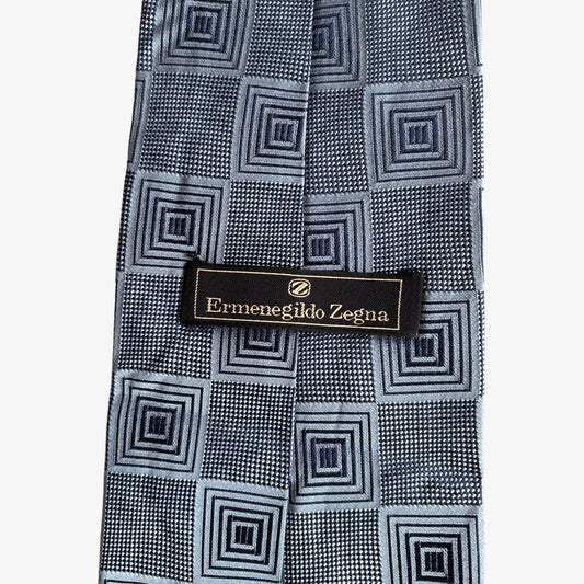Label of vintage 90s Ermenegildo Zegna geometric abstract print silver silk tie.
