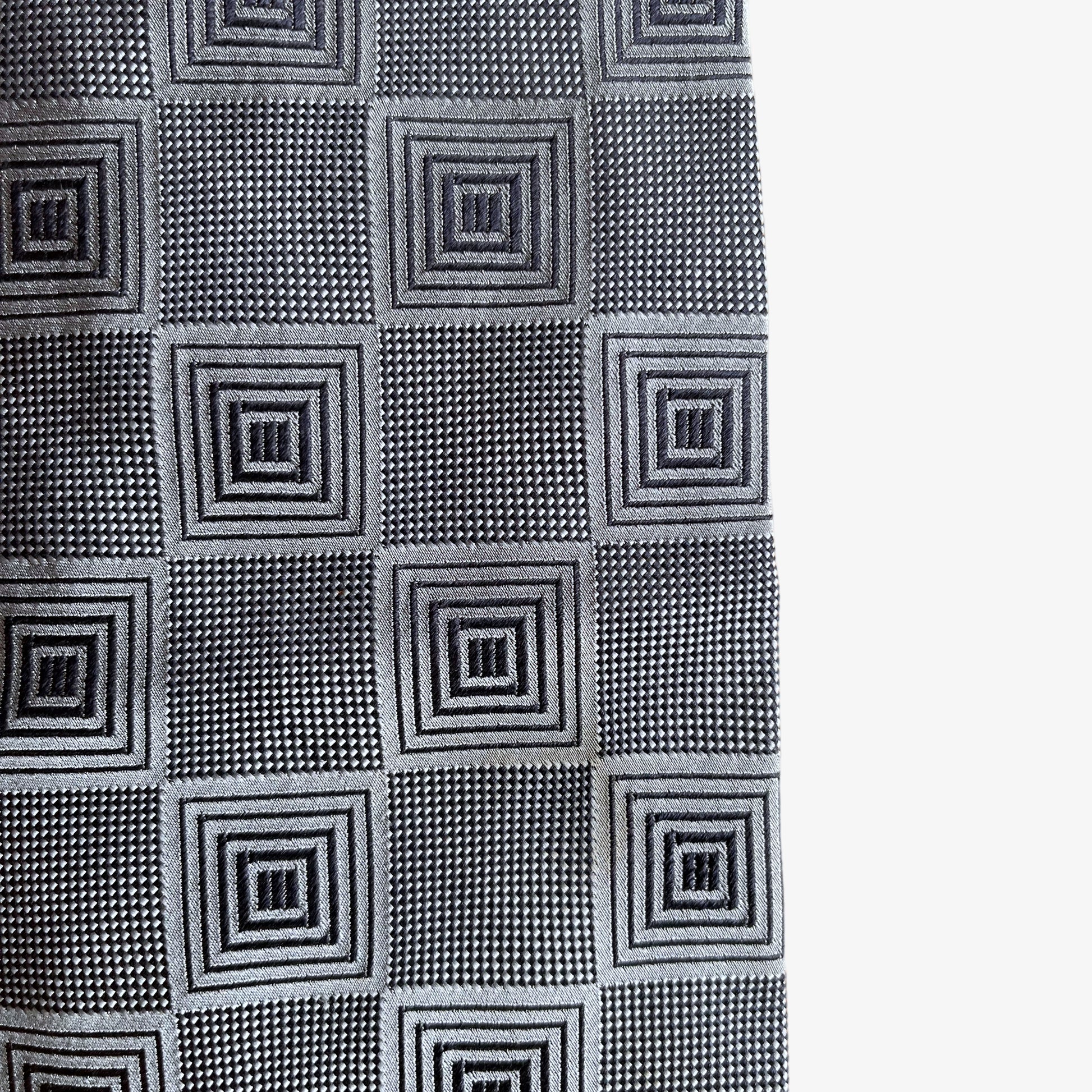 Wear on a vintage 90s Ermenegildo Zegna geometric abstract print silver silk tie.