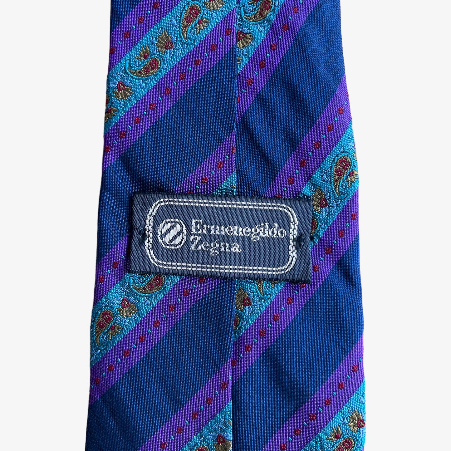 Label of vintage 90s Ermenegildo Zegna paisley print striped silk tie.