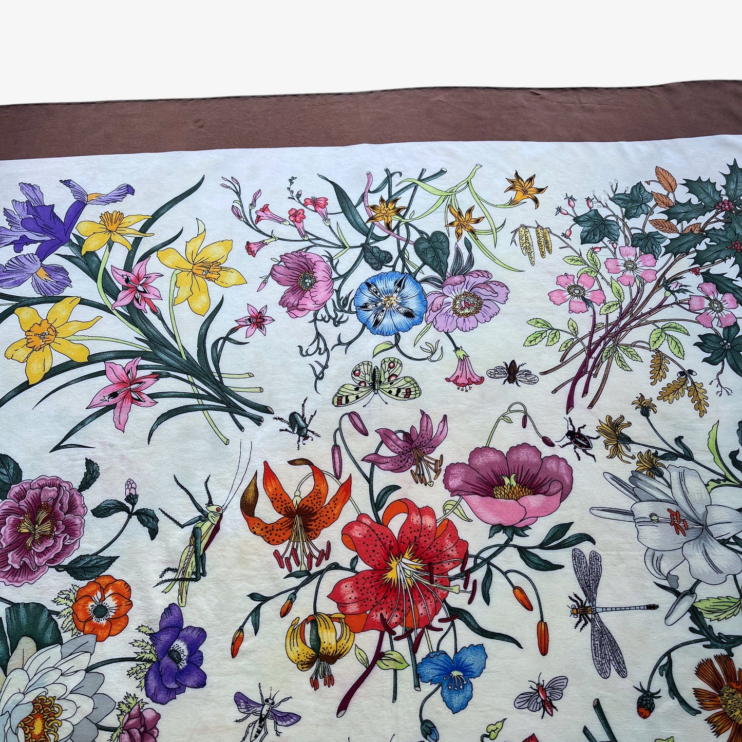 Green butterfly pattern on women's 90s vintage Gucci colourful floral and insect print brown silk scarf designed by Vittorio Accornero.