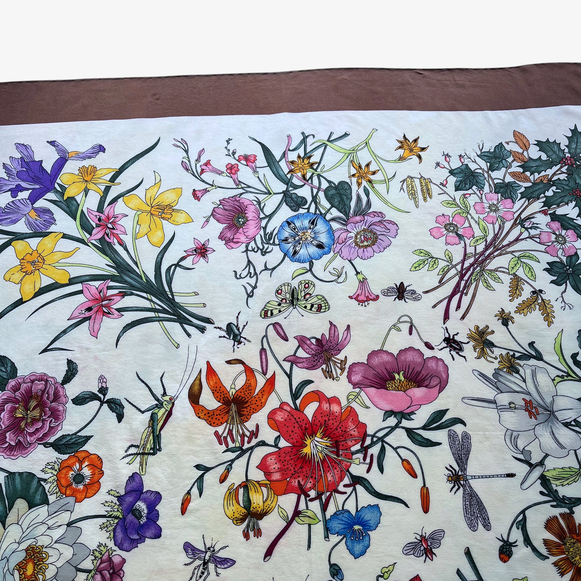 Green butterfly pattern on women's 90s vintage Gucci colourful floral and insect print brown silk scarf designed by Vittorio Accornero.