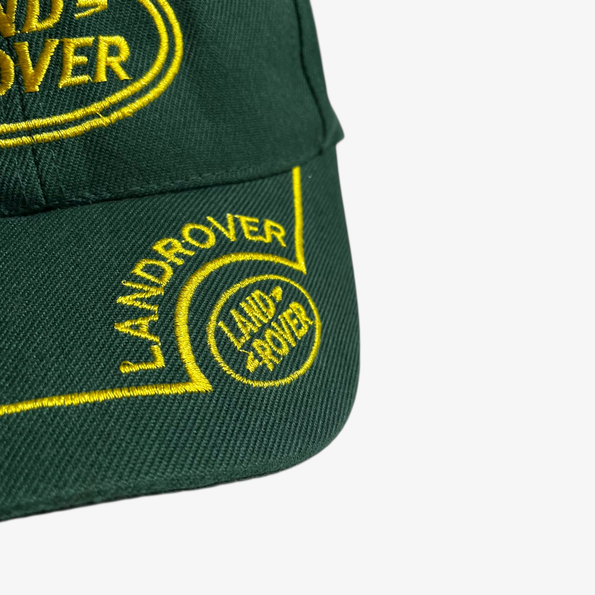Embroidered logo on the rim of vintage 90s Land Rover green cap.