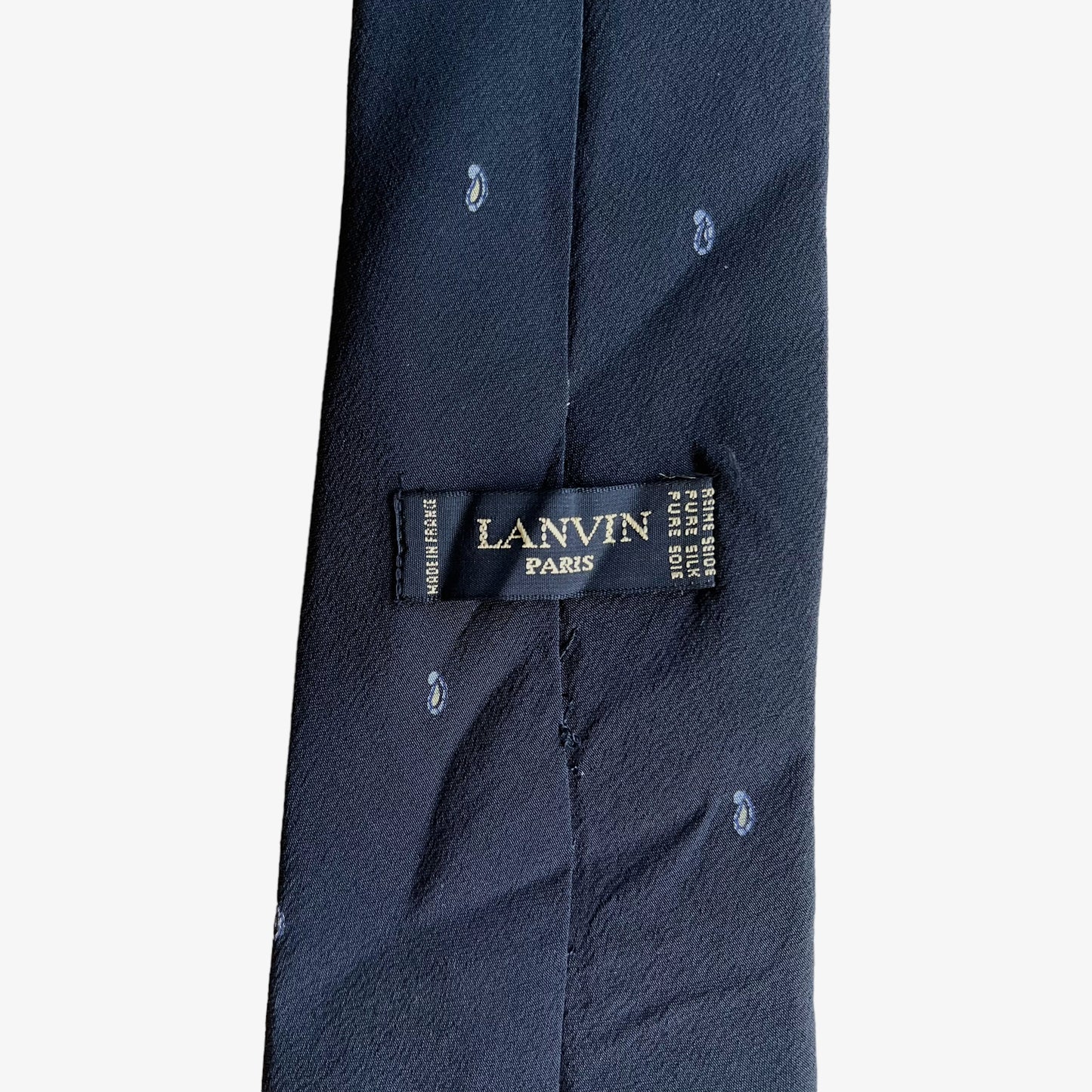Label of vintage 90s Lanvin Paris geometric paisley print silk tie.