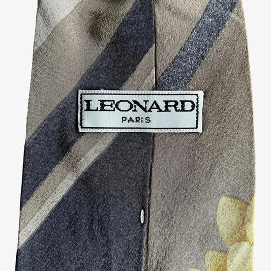 Label of vintage 90s Leonard striped abstract floral print silk tie.