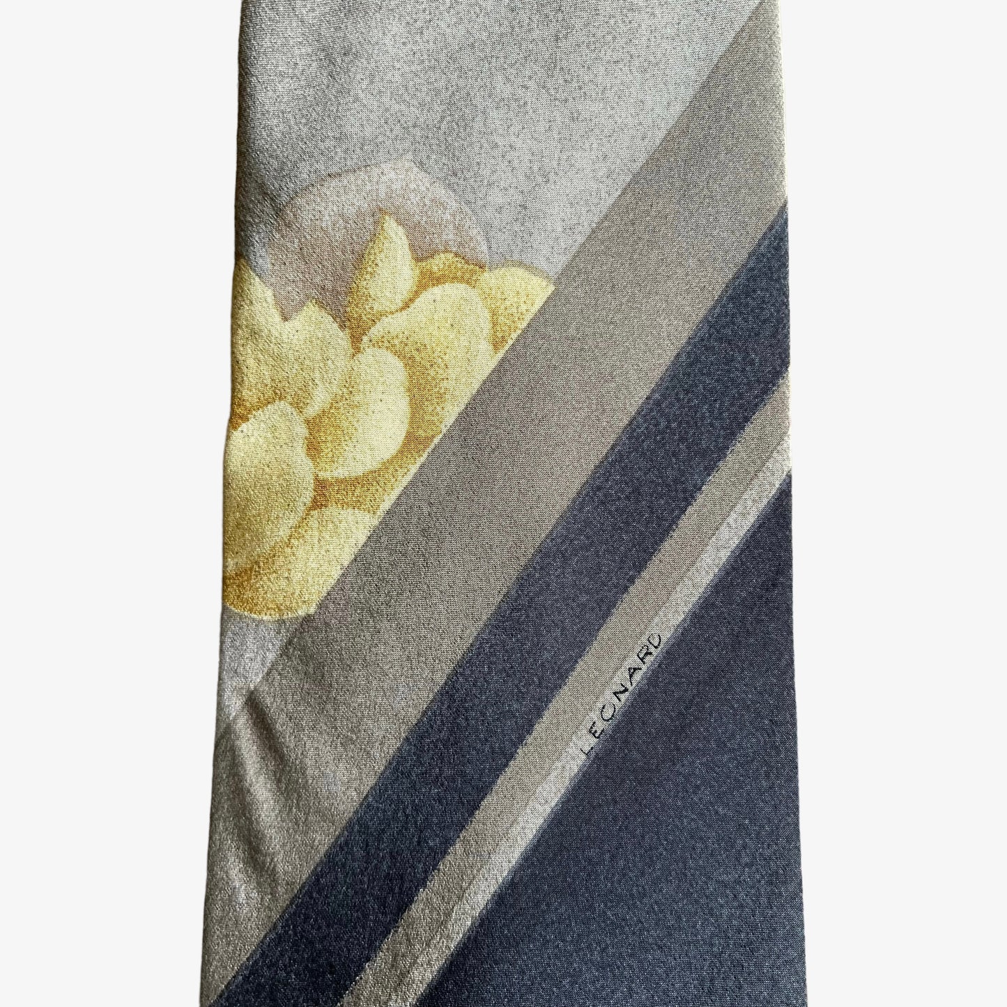 Close up of pattern on vintage 90s Leonard striped abstract floral print silk tie.