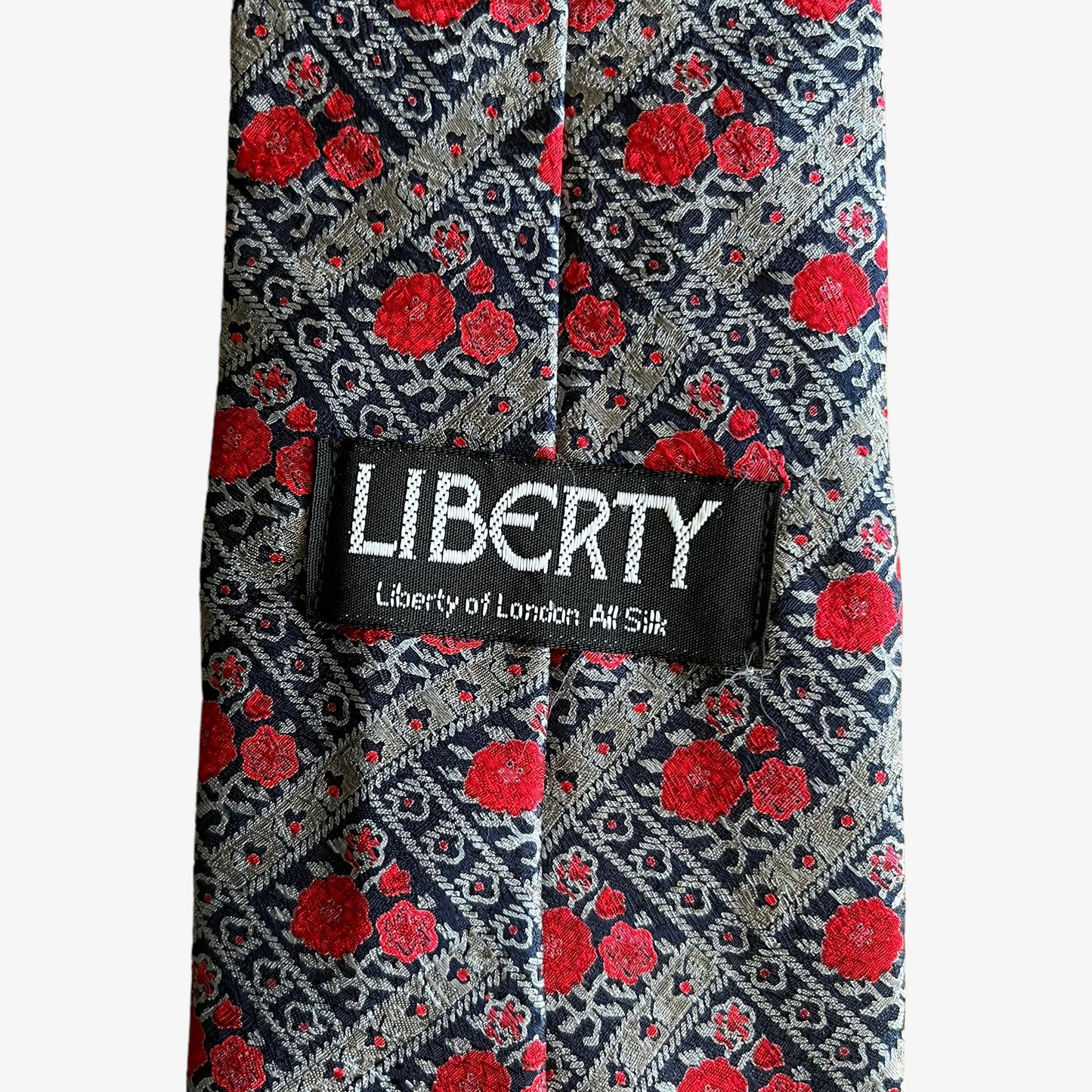 Vintage 90s Liberty of London floral print silk tie label.