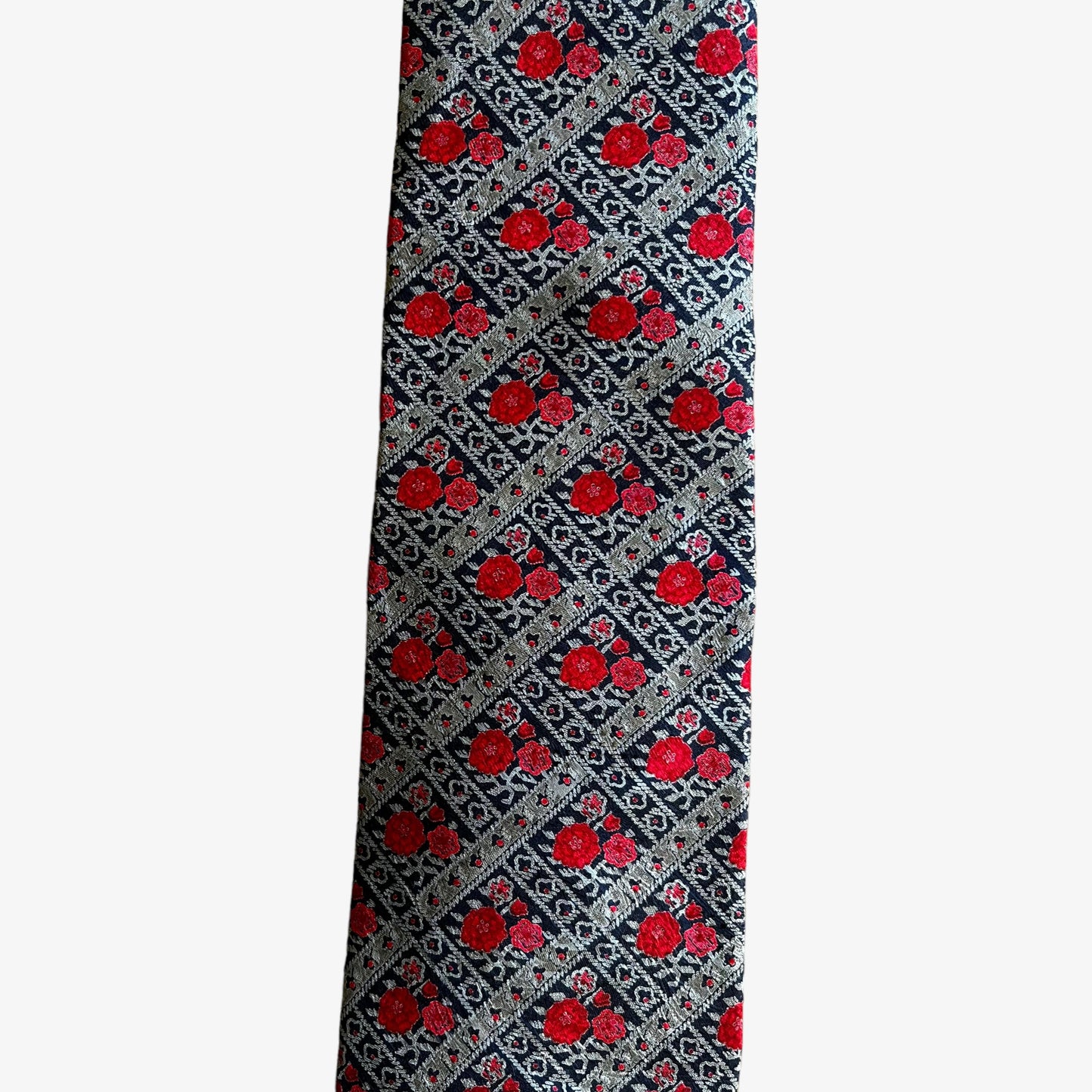 Close up of pattern on vintage 90s Liberty of London floral print silk tie.