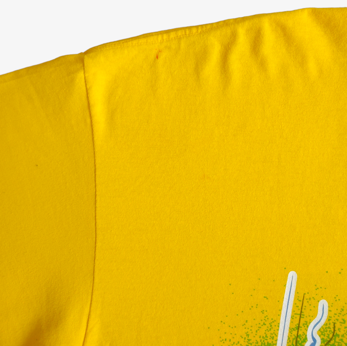 Wear on shoulder on vintage 90s Ernie Irvan M&M NASCAR racing team yellow t-shirt.