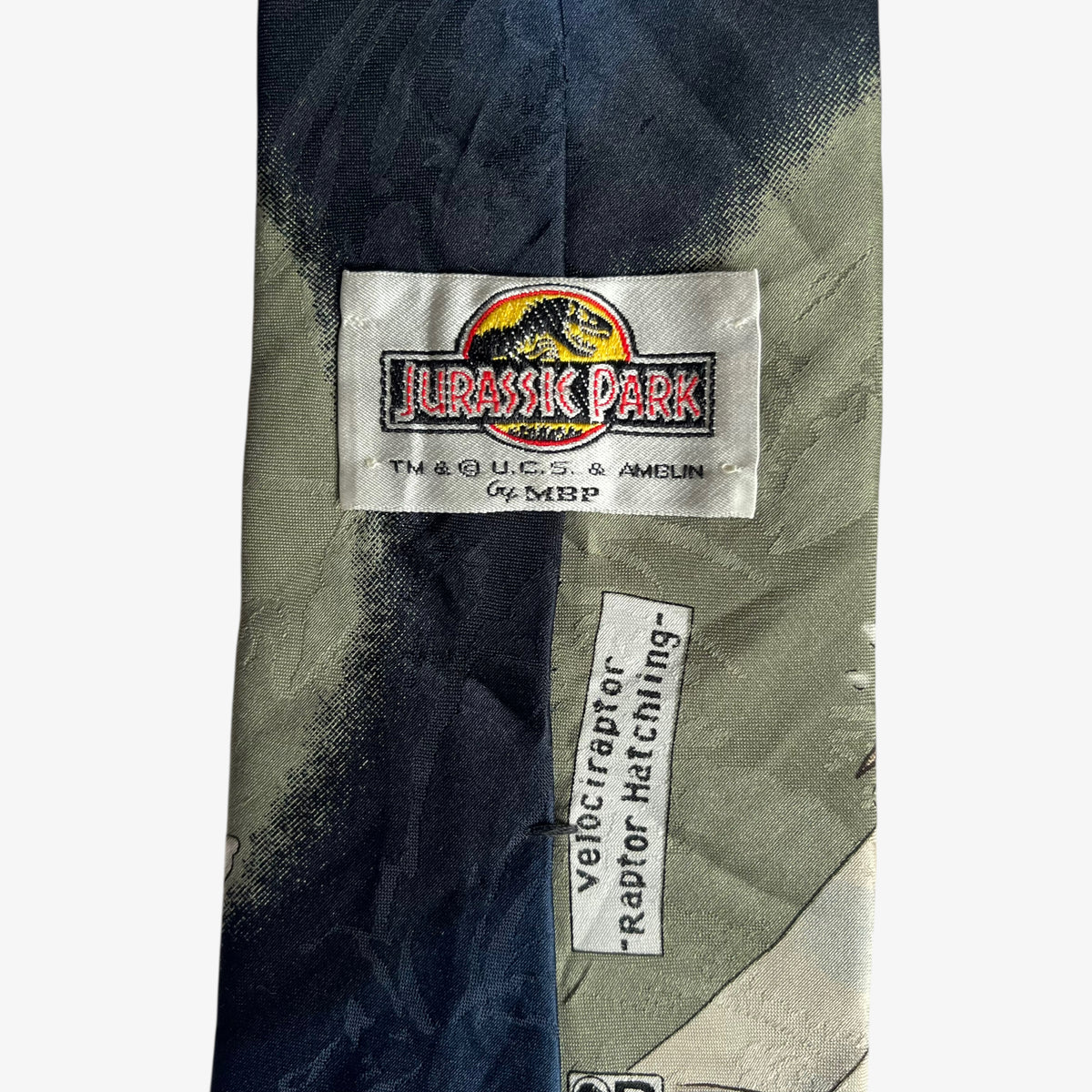 Vintage 90s MBP Jurassic Park Velociraptor Hatchling Print Tie Label - Casspios Dream