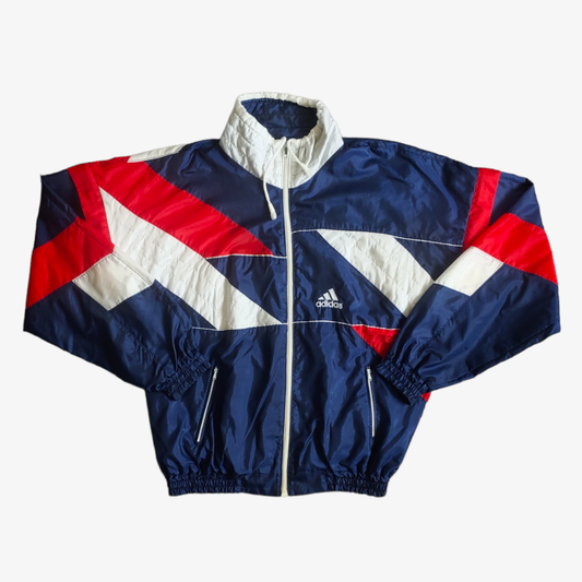 Vintage 90s Adidas England template track jacket in navy, red, and white colours with a geometric pattern, featuring a full zipper and Adidas logo on the chest.