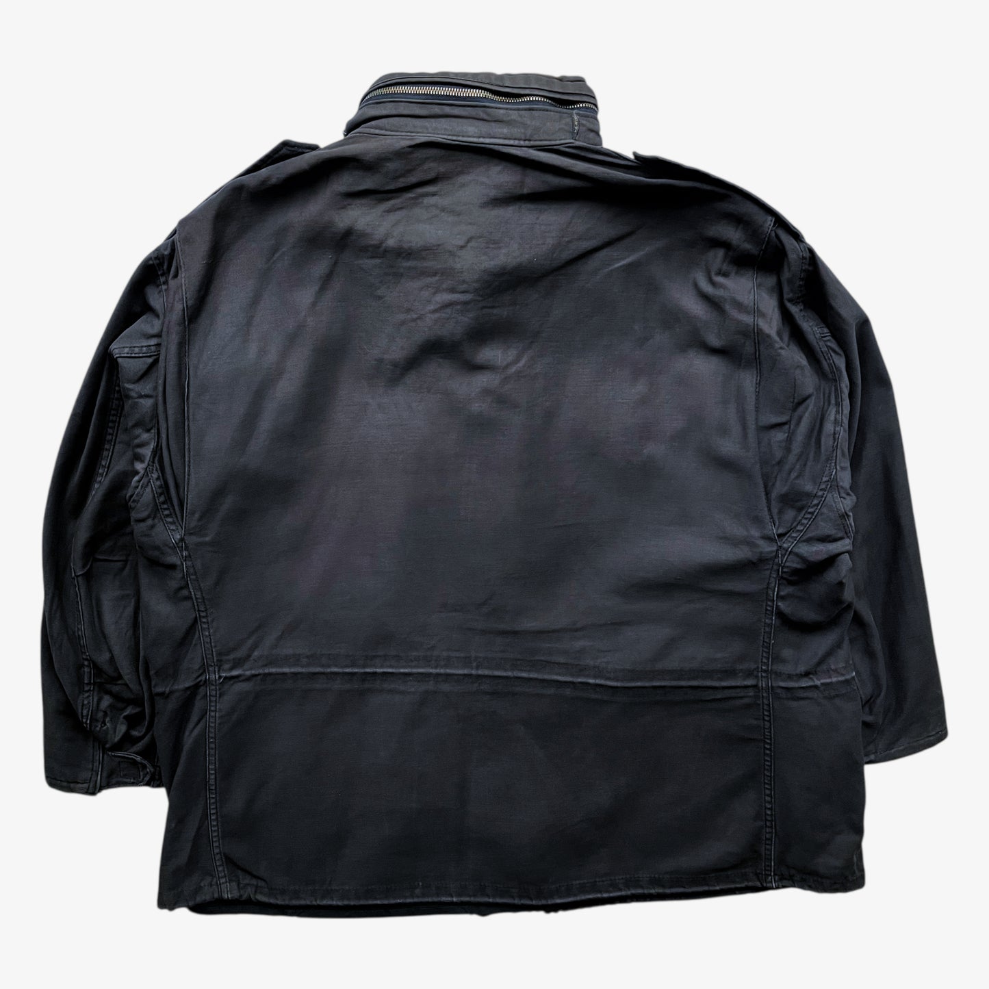 Back of vintage 90s men's Alpha Industries brown M65 cold weather field jacket.