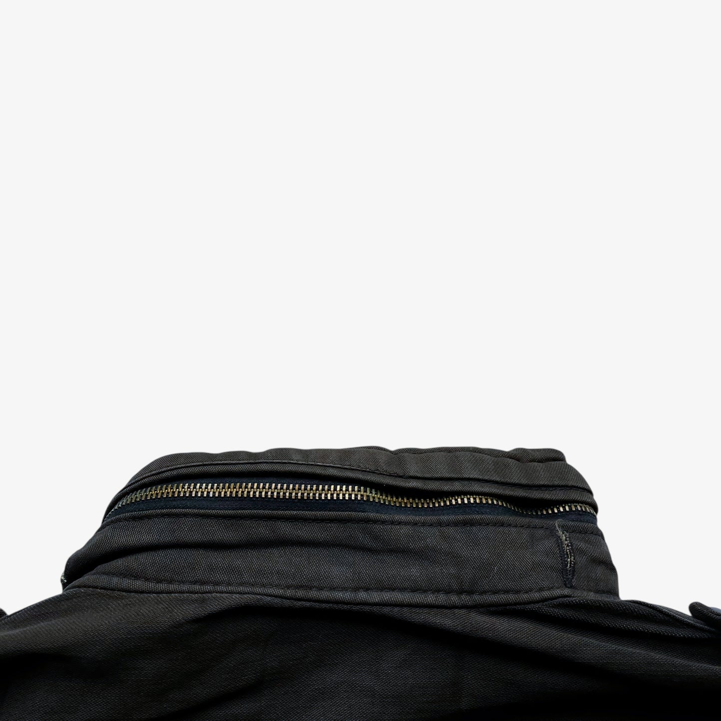 Foldable hood of vintage 90s men's Alpha Industries brown M65 cold weather field jacket.