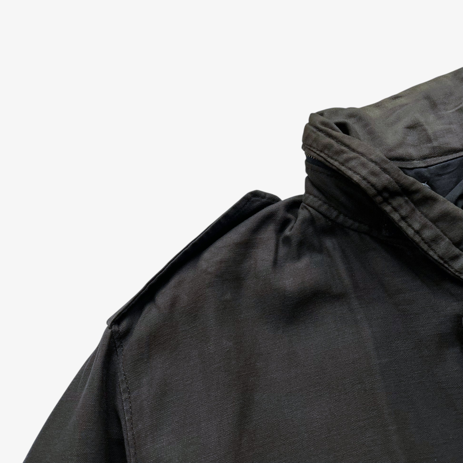 Patina on vintage 90s men's Alpha Industries brown M65 cold weather field jacket.