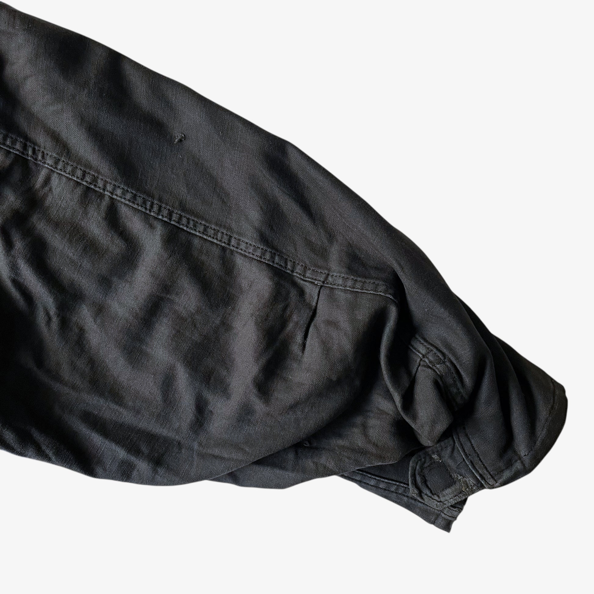 Sleeve of vintage 90s men's Alpha Industries brown M65 cold weather field jacket.