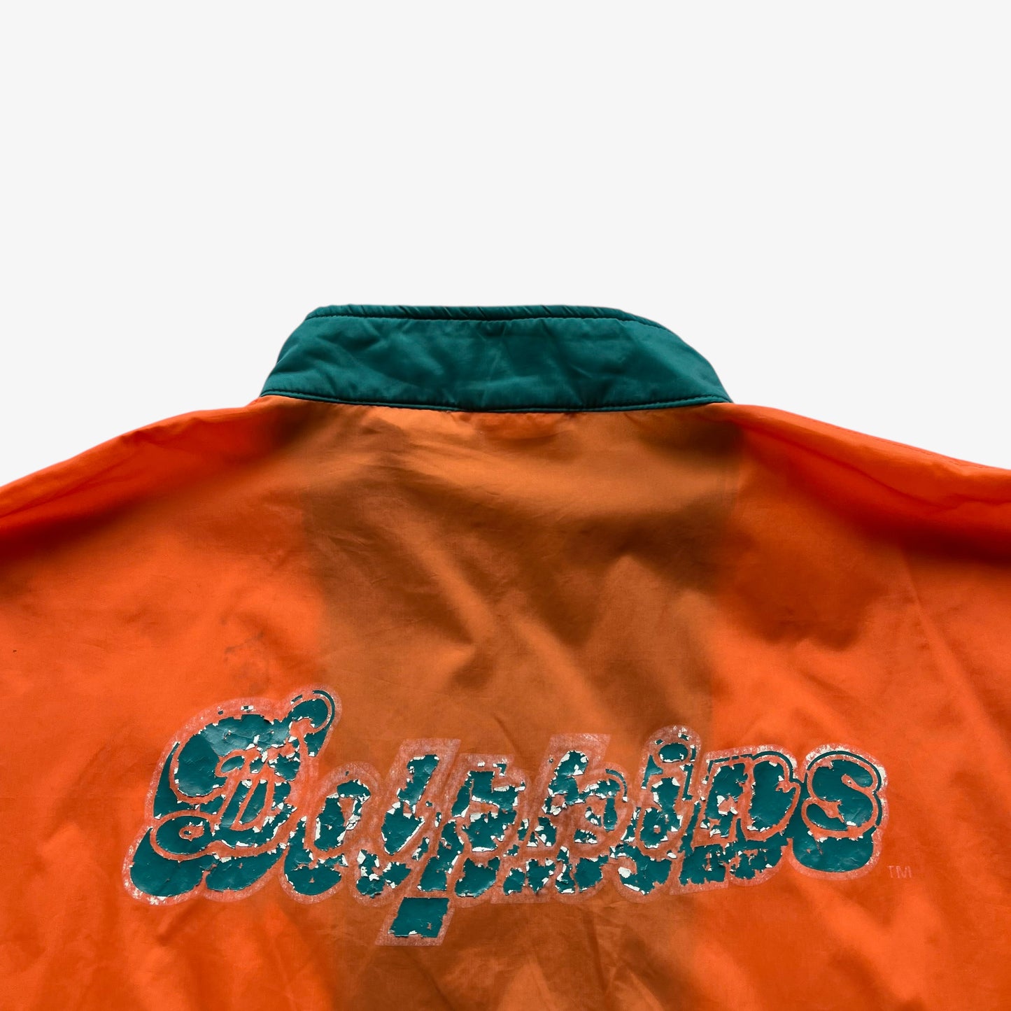 Back printed spell out on men's vintage 90s Apex One NFL Miami Dolphins jacket.