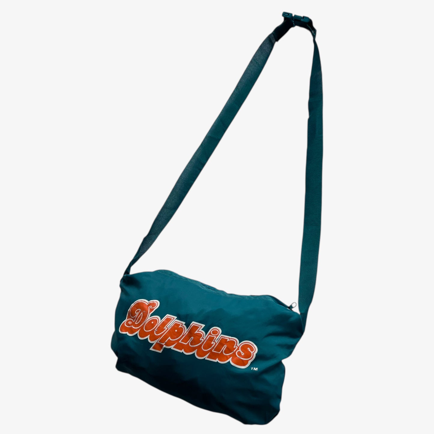 Men's vintage 90s Apex One NFL Miami Dolphins jacket with foldable bag.