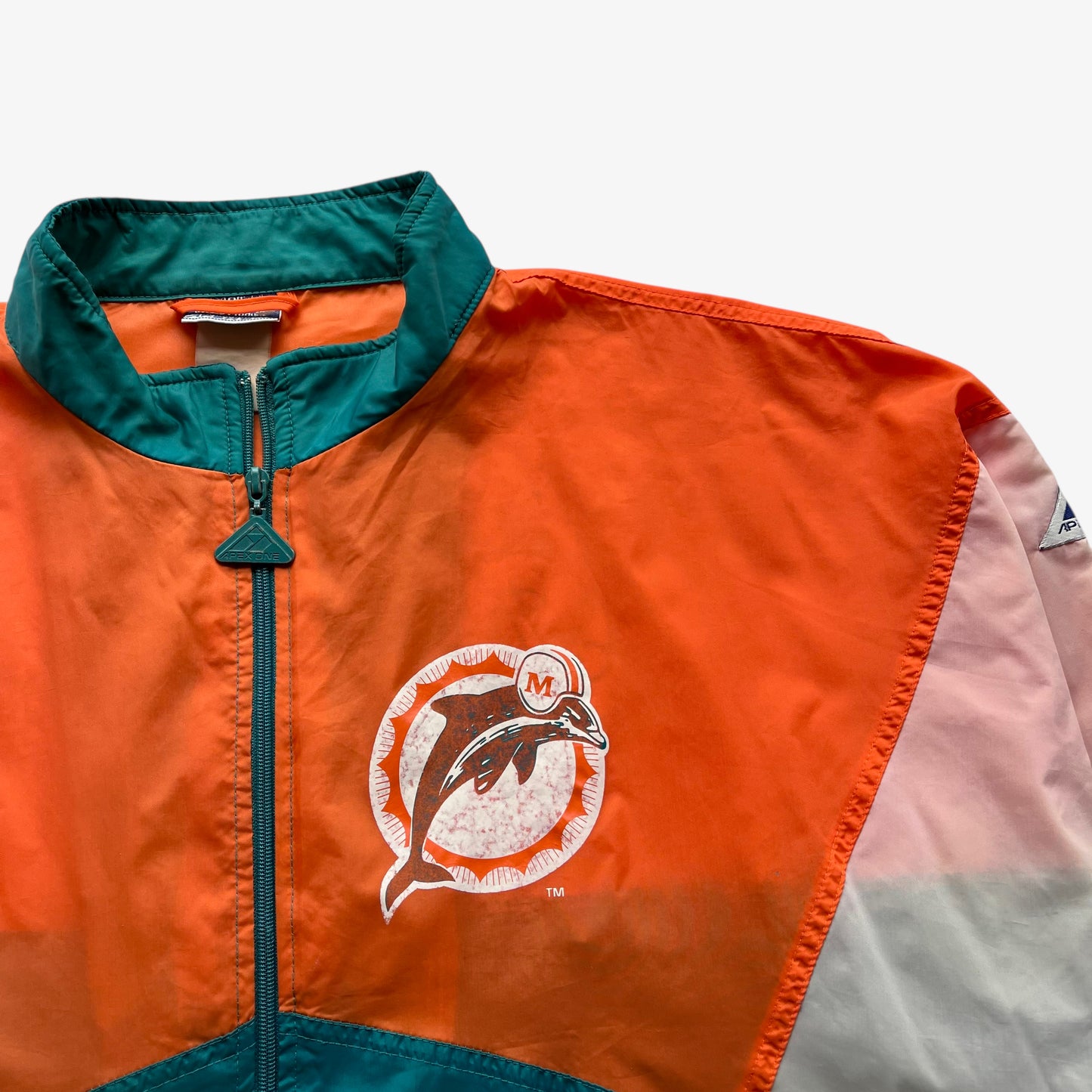 Miami Dolphins logo printed on men's vintage 90s Apex One NFL jacket.