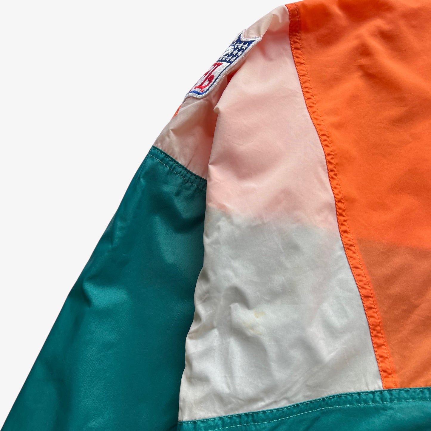 Patina on men's vintage 90s Apex One NFL Miami Dolphins jacket.