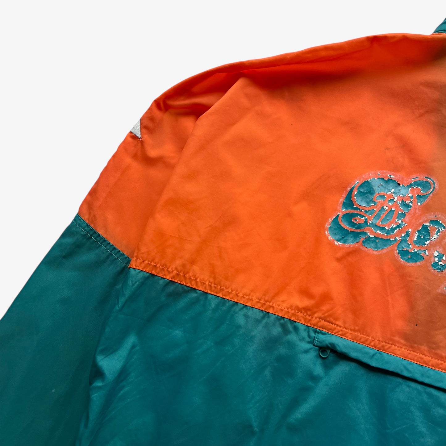 Back pocket on men's vintage 90s Apex One NFL Miami Dolphins jacket.