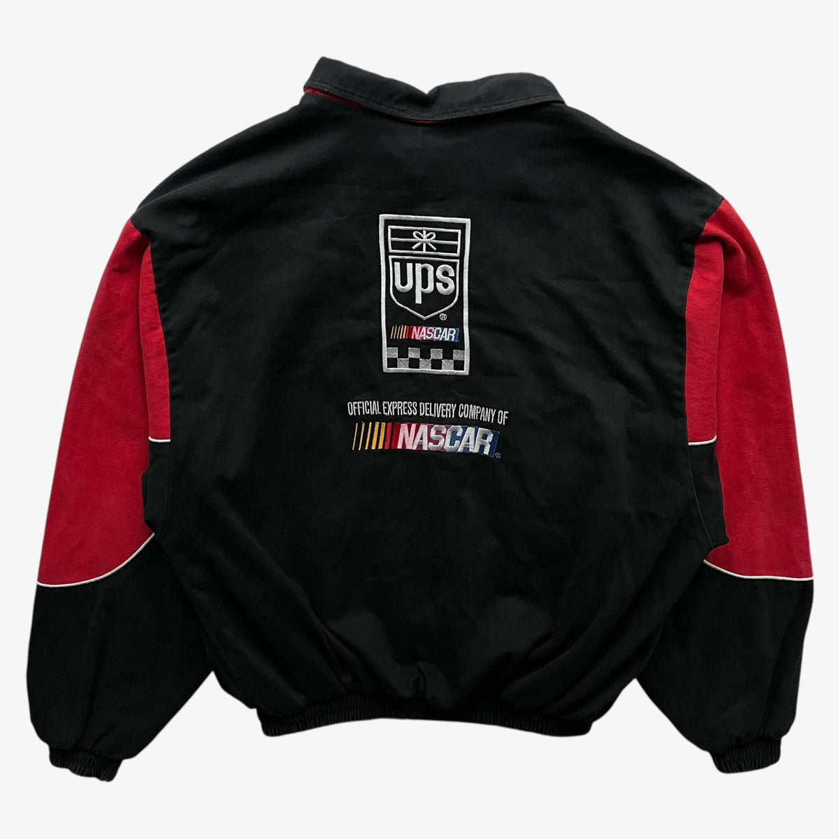 Back of vintage 90s men's Ashley UPS black and red nascar jacket.