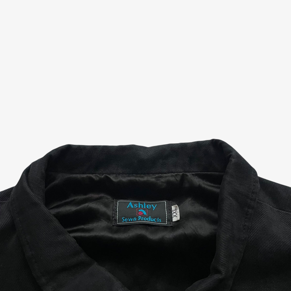 Ashely label stitched inside of vintage 90s men's UPS black and red nascar jacket.