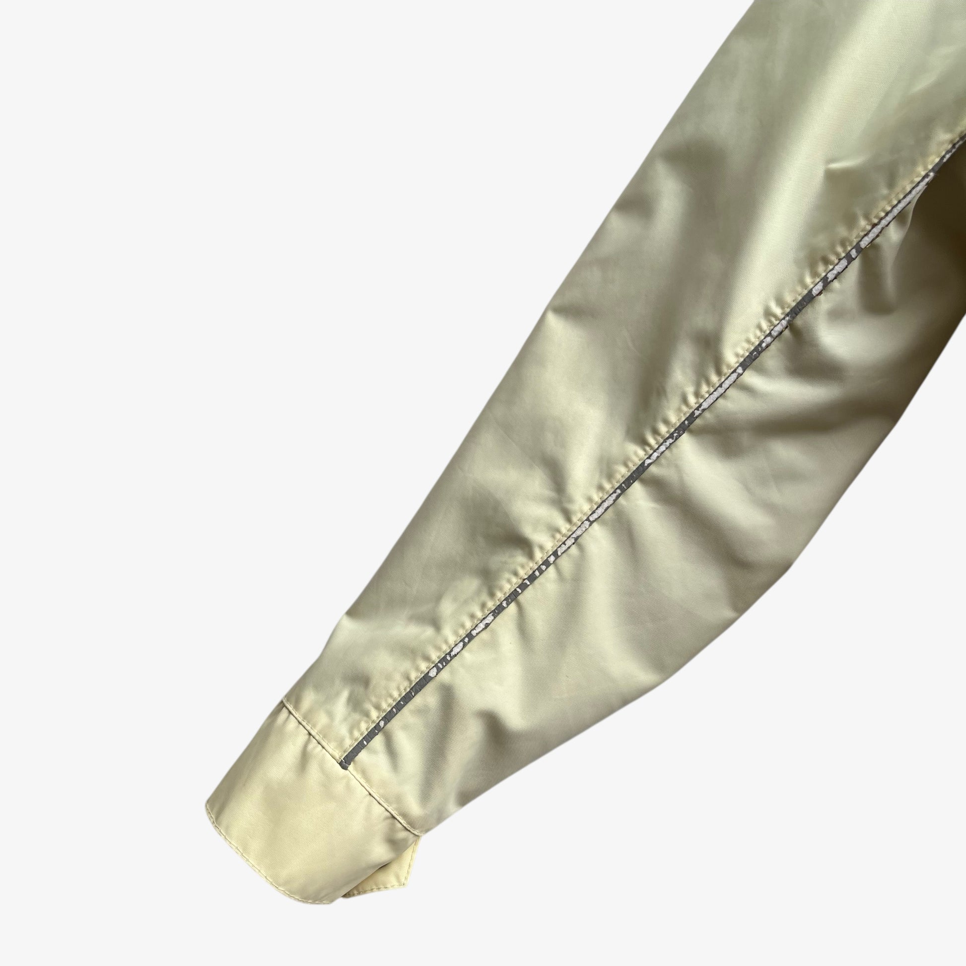 Arm of vintage 90s men's Belstaff tourmaster 500 cream biker jacket.