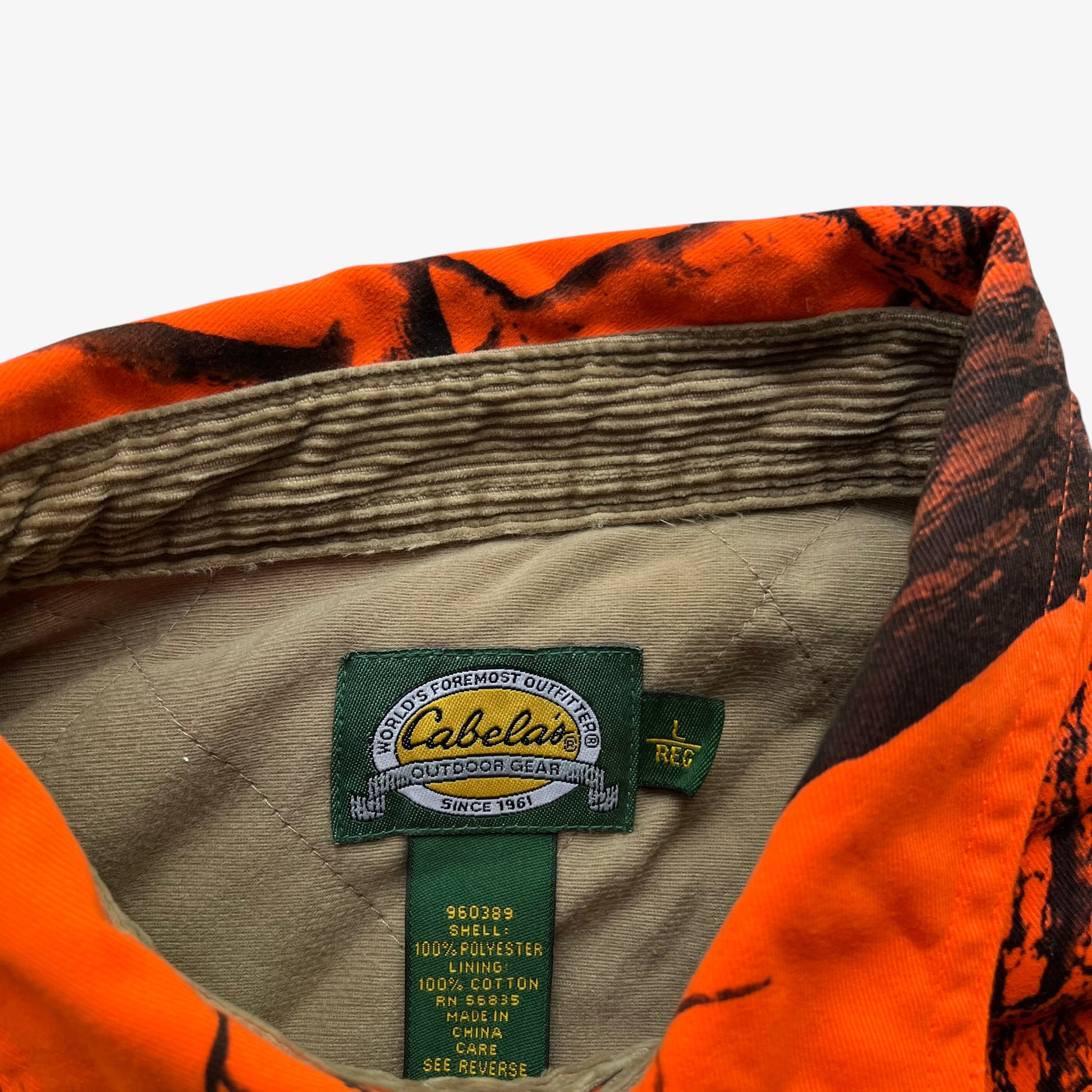 Cabela's label stitched inside of vintage 90s men's real tree hardwoods orange camouflage hunting jacket.